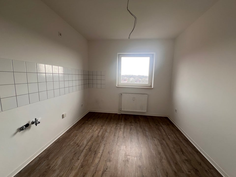 Helle 3-Zimmer-Dachgeschoss-Wohnung mit Weitblick! - Foto 2