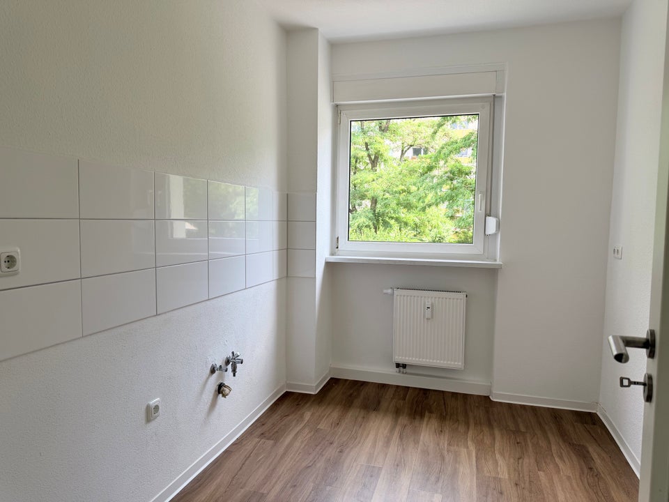 Ein Zuhause für Familien: zentral gelegen, von Grün umgeben - Photo 4