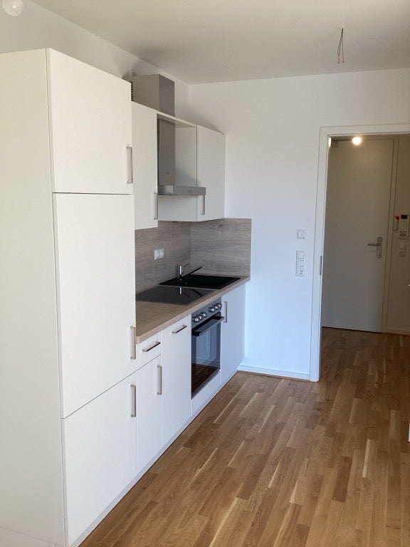 Gemütliche 1 Raum Wohnung mit Einbauküche im Neubau - Foto 1
